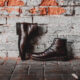 closeup pair classic shoes brick wall 80x80